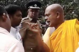 buddhist-monk-threatening-to-ki-300x198